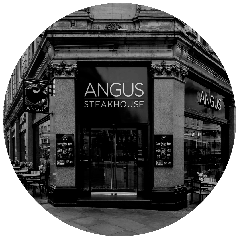 A black and white photo of the angus steakhouse