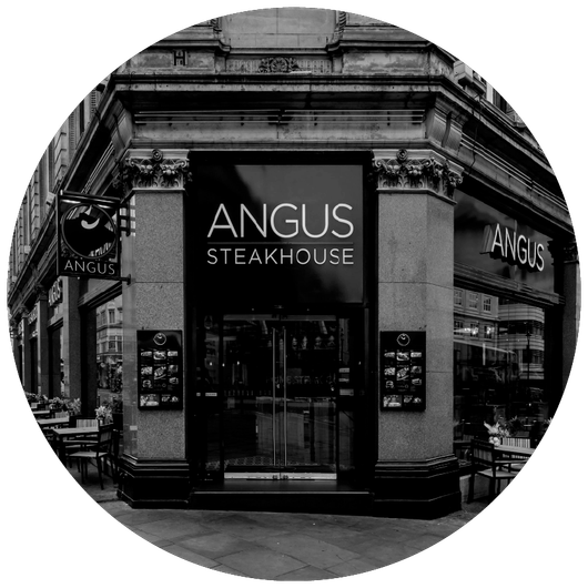 A black and white photo of the angus steakhouse