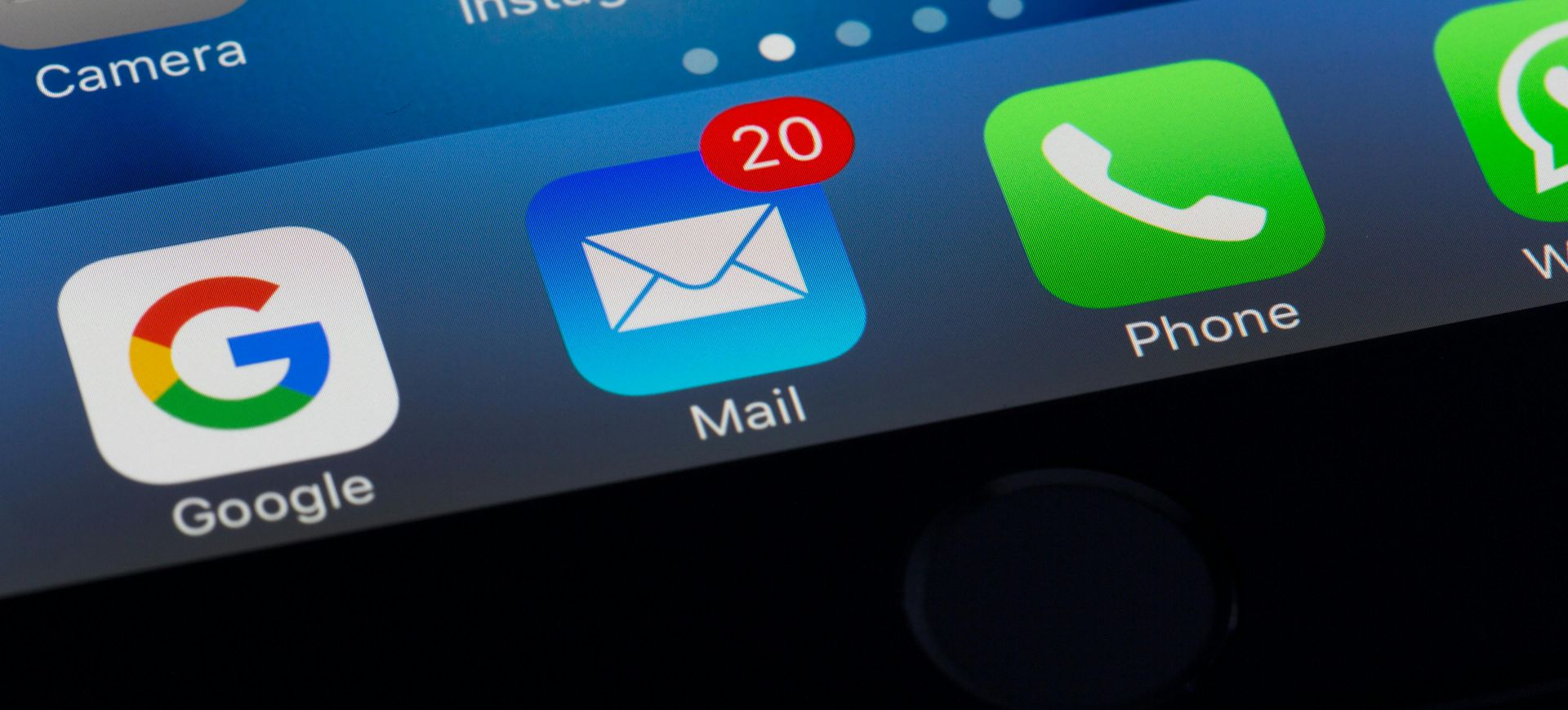 Close-up of a smartphone screen showing the Google, Mail (with 20 notifications), and Phone app icons.