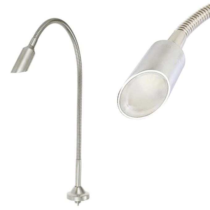 A close up of a stainless steel gooseneck lamp on a white background.