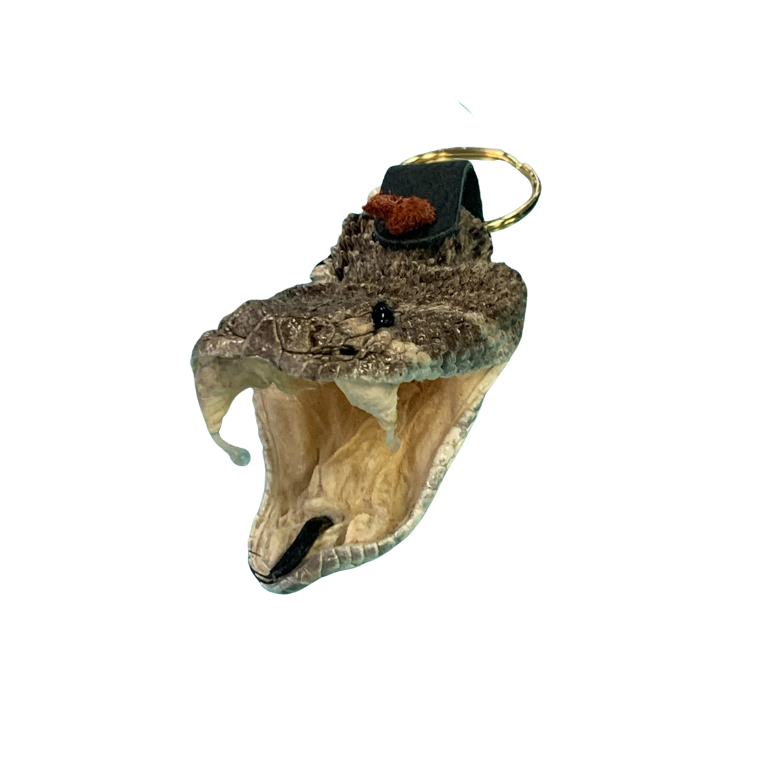 A key chain with a snake head on it