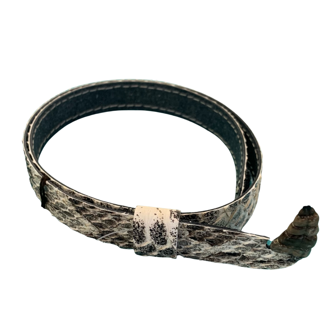 A snakeskin belt with a turquoise buckle on a white background