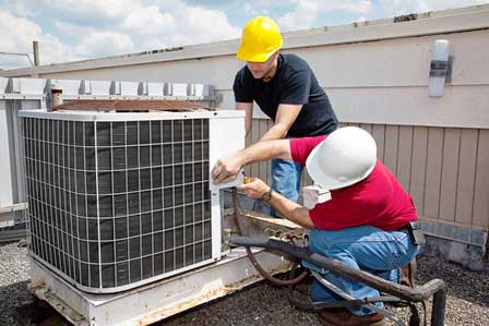 Two Men Repairing Air Conditioner - HVAC Contractor in North Versailles, Pennsylvania