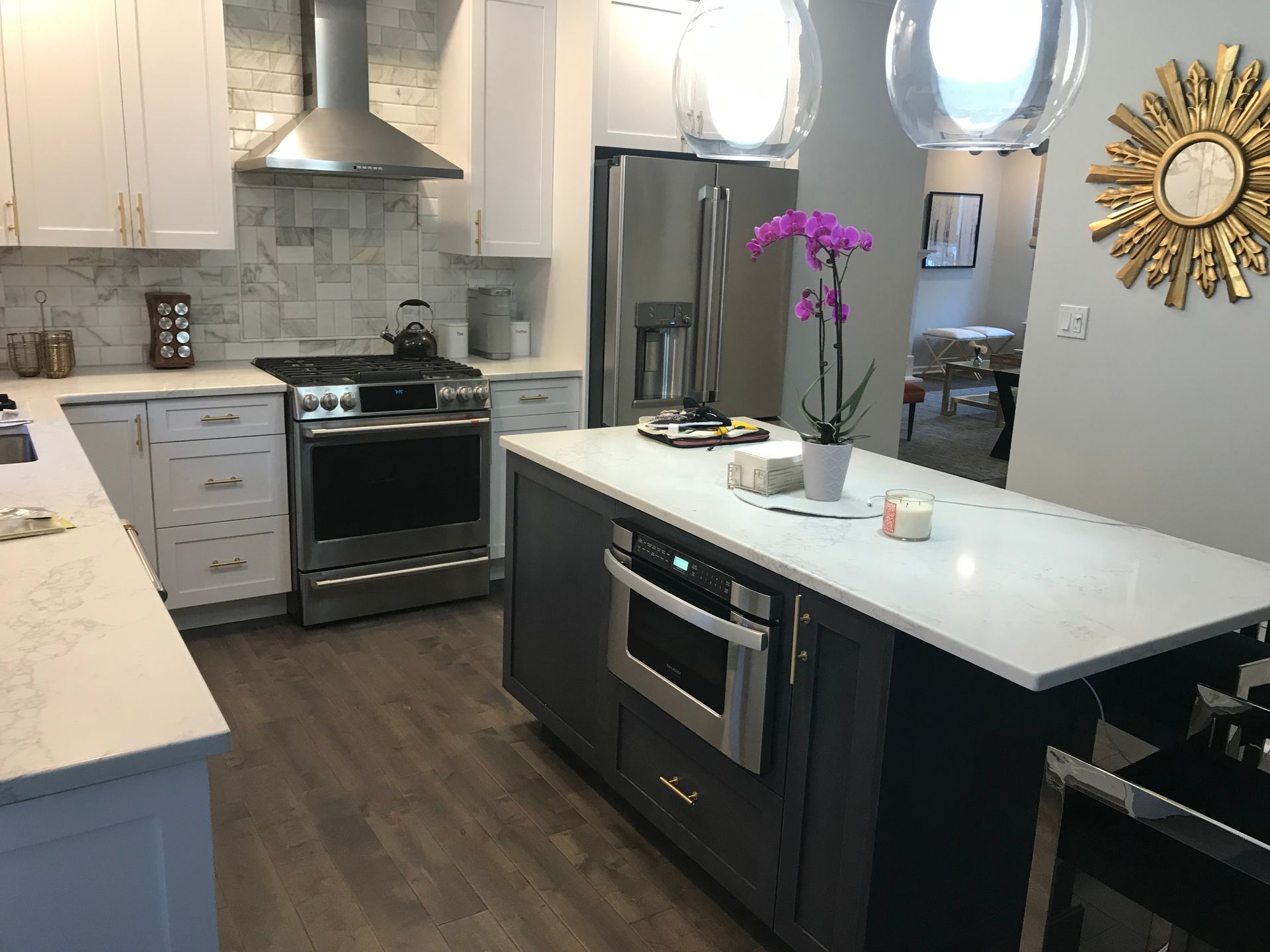 A kitchen with a large island in the middle of it.