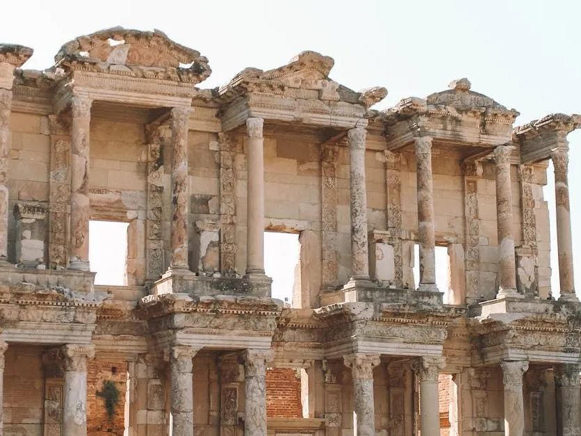 A very old building with columns and arches.