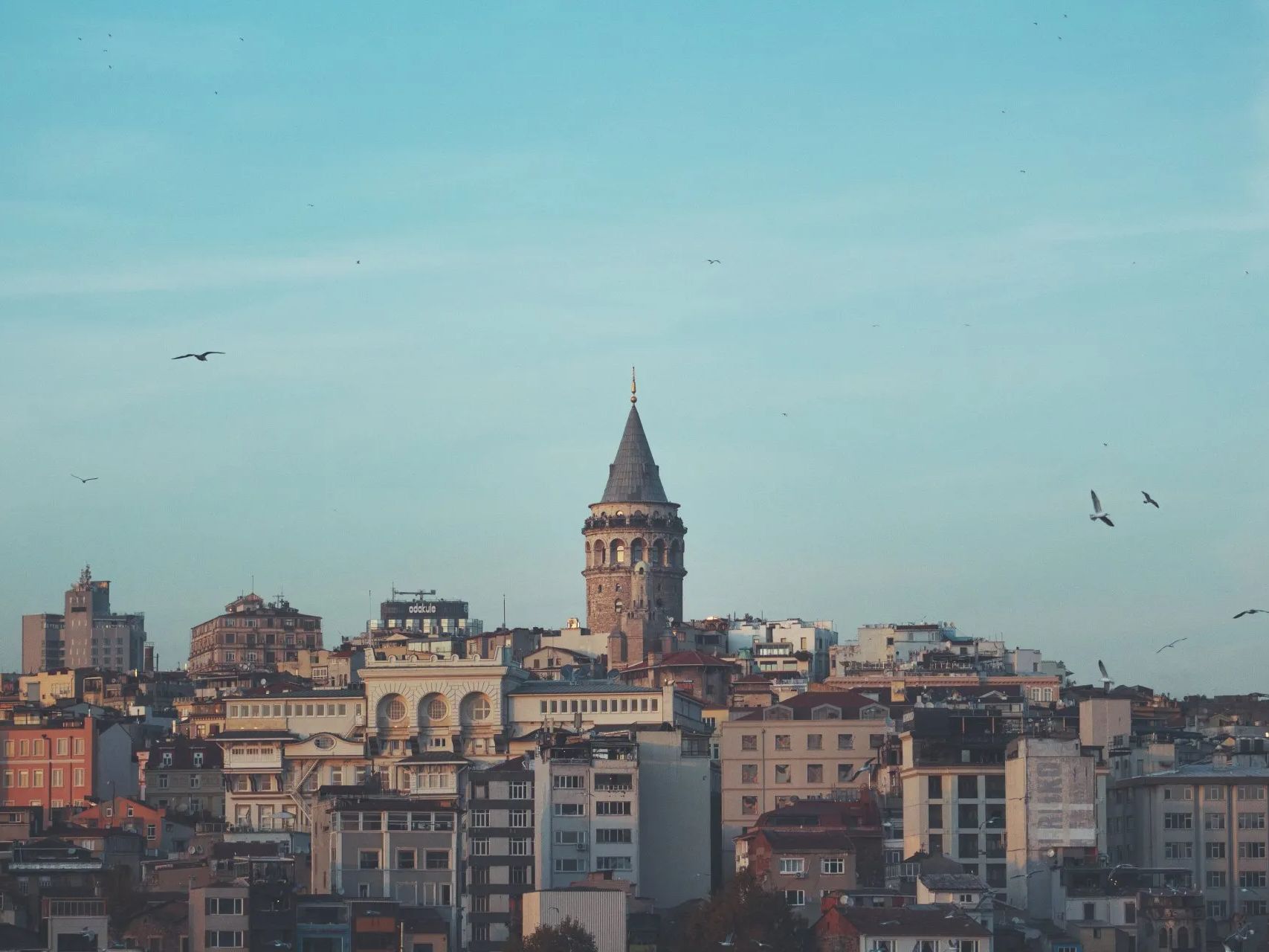 A cityscape with a tower in the middle of it