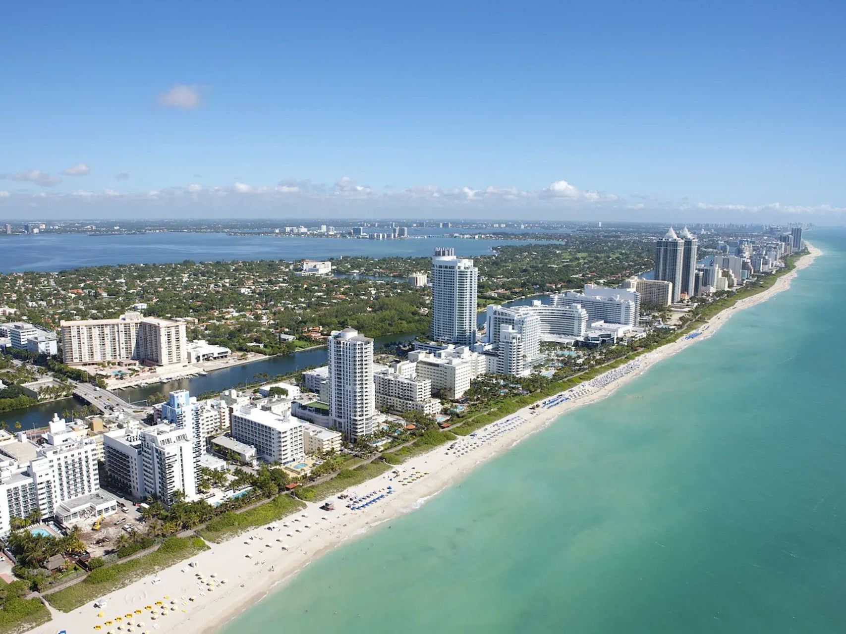 An aerial view of a city and a beach.