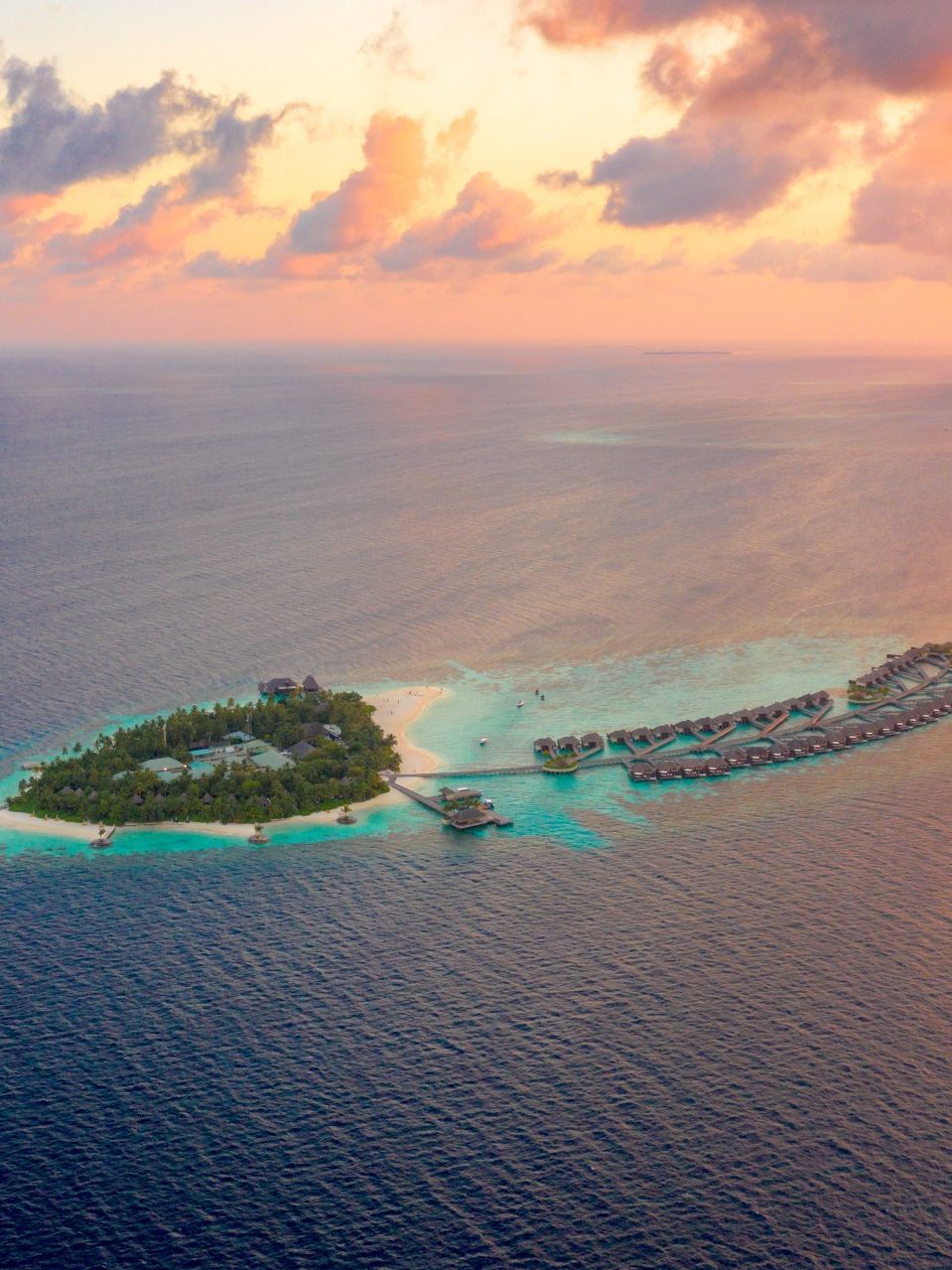 An aerial view of a small island in the middle of the ocean.