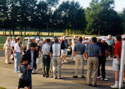 A close up of a steering wheel with a scorecard on it.
