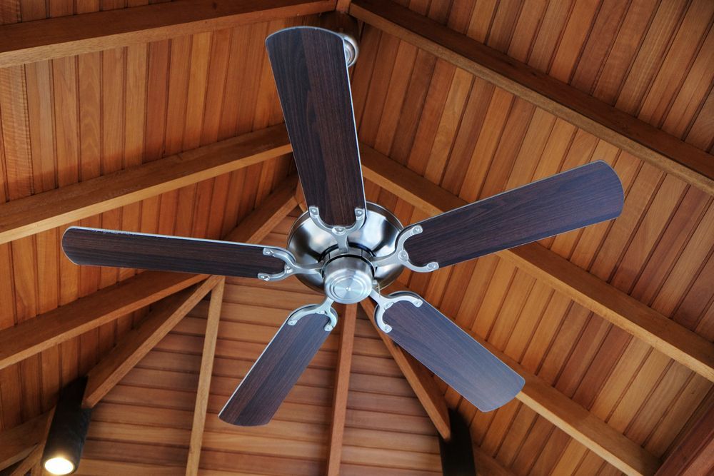 Ceiling Fan With Dark Wood Blades in a Wooden Ceiling — Elite Electrical Ballarat in Delacombe, VIC