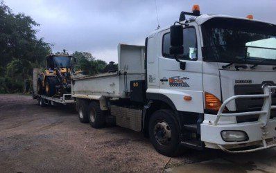 Guy with Excavator behind — Excavation in Sarina Australia