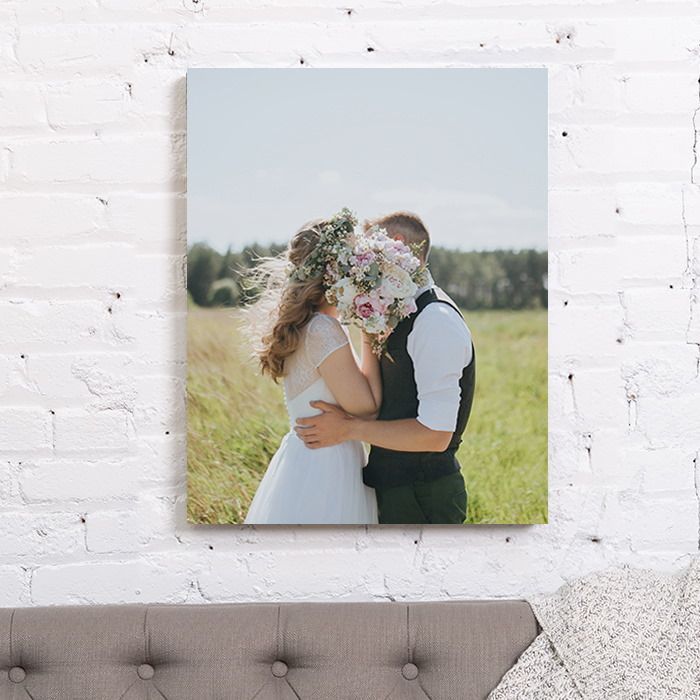 Canvas on wall with a desk and a chair