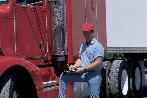 Red Truck and Driver — Jacksonville, FL — Paul Murray Oil Inc