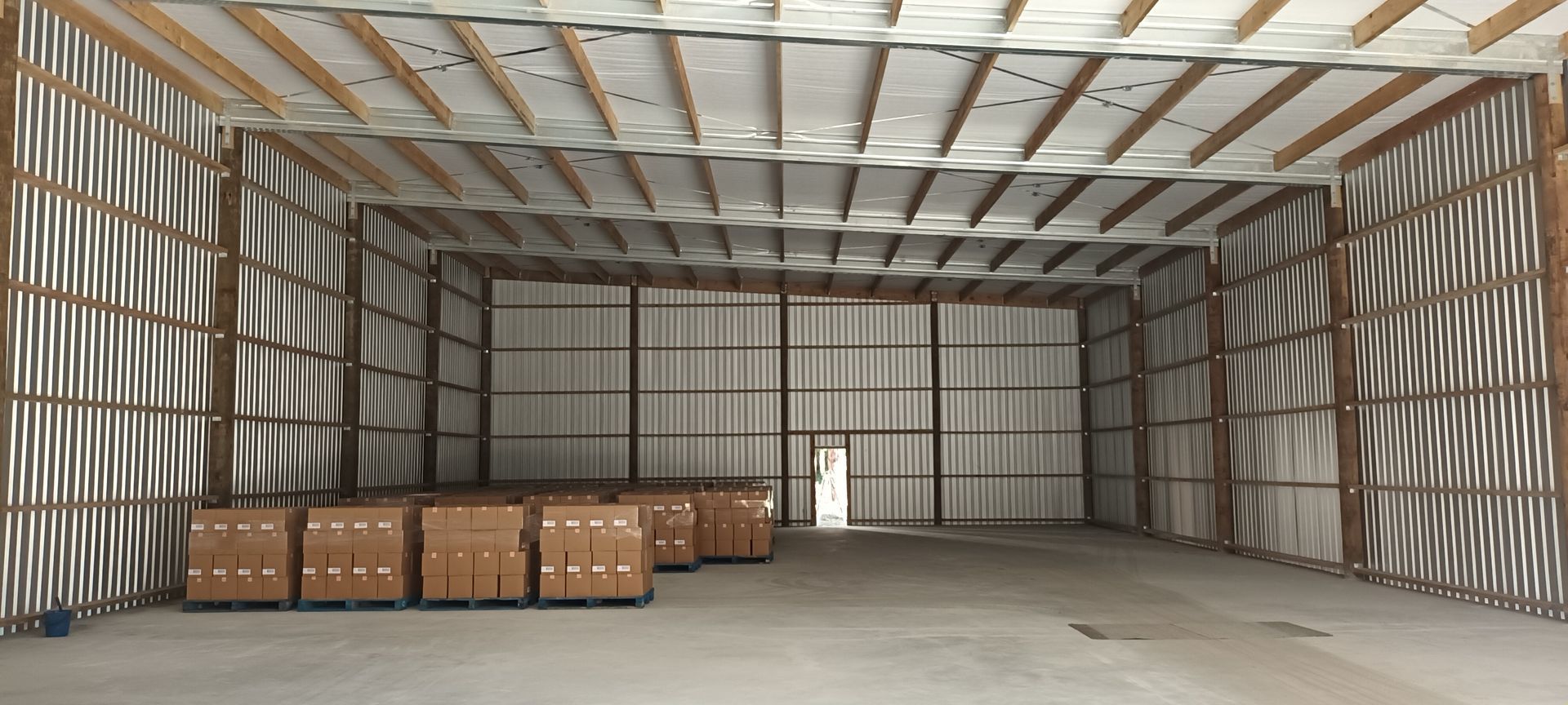 A large warehouse with a lot of boxes in it.