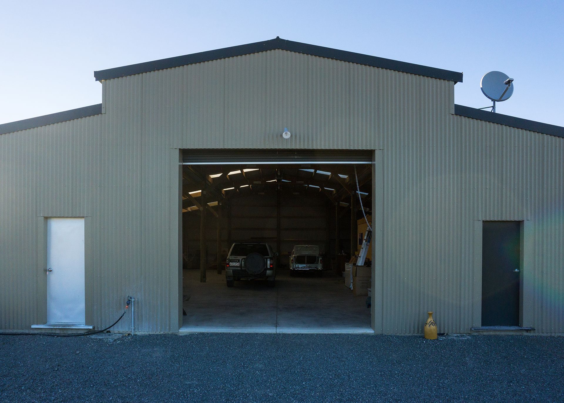 A garage with a satellite dish on top of it