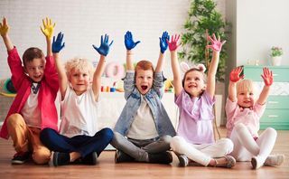 Group of Children Raising Hands — Norfolk, NE — Montessori Circle of Friends