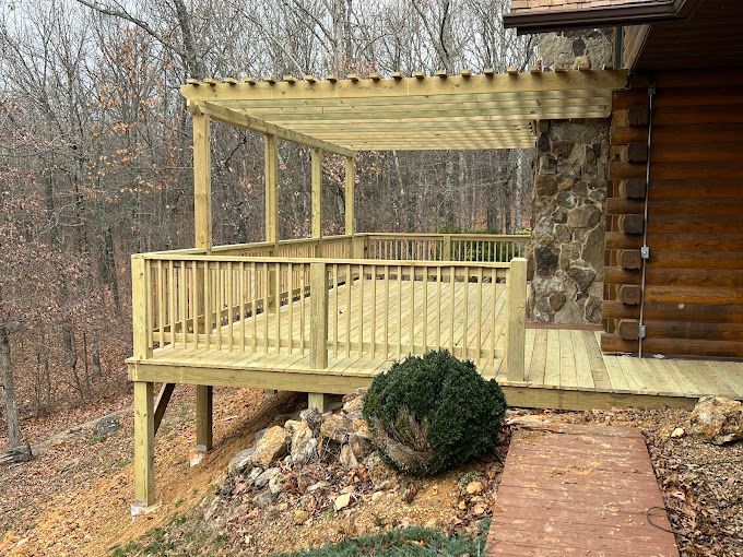 A wooden deck with a pergola attached to it