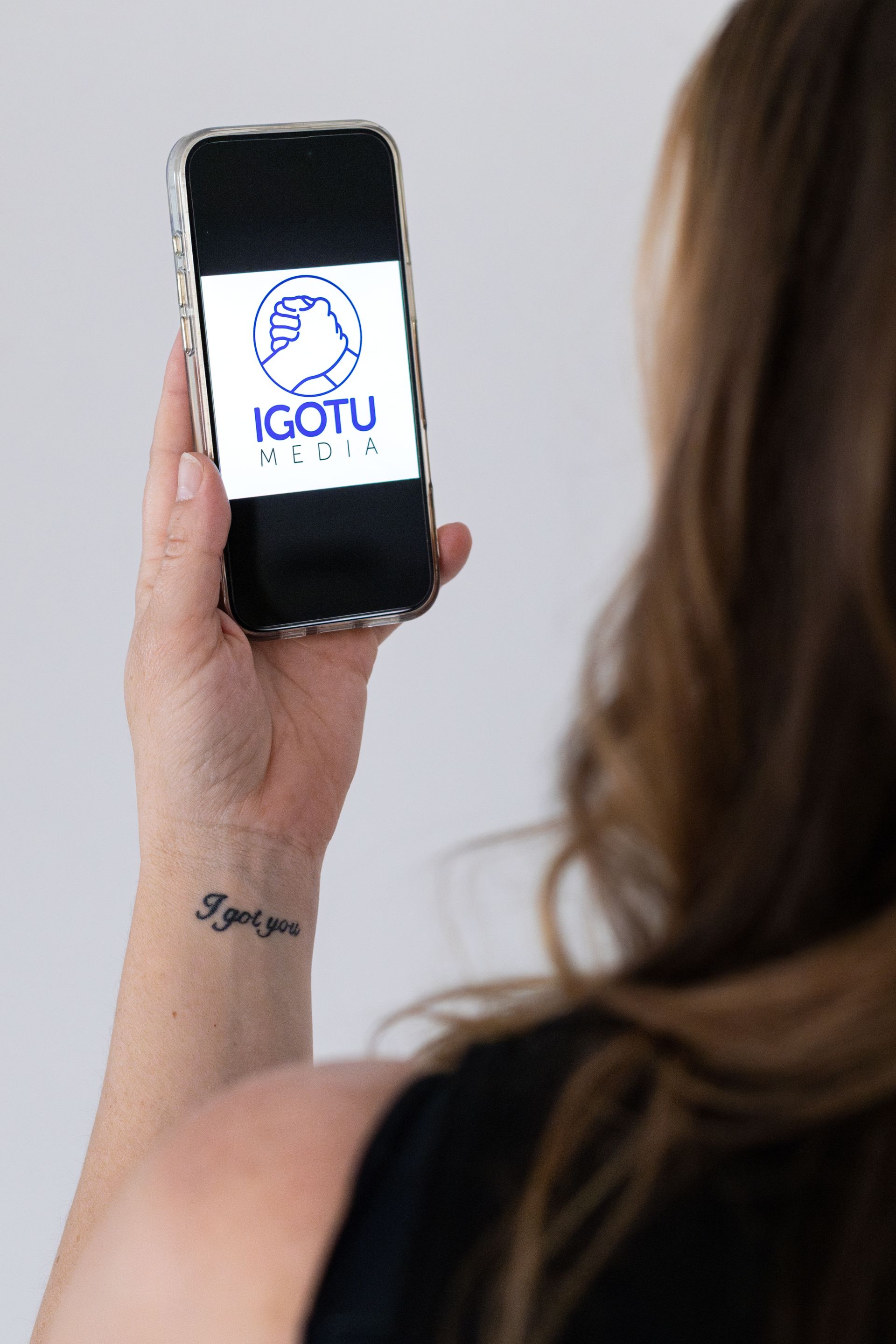 Woman holding smartphone with