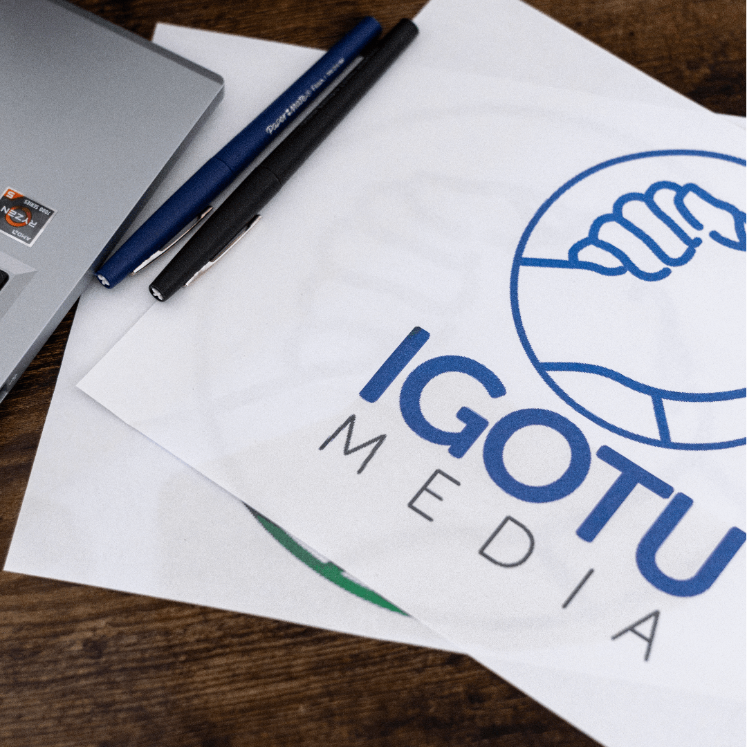 A piece of paper with igotu media written on it