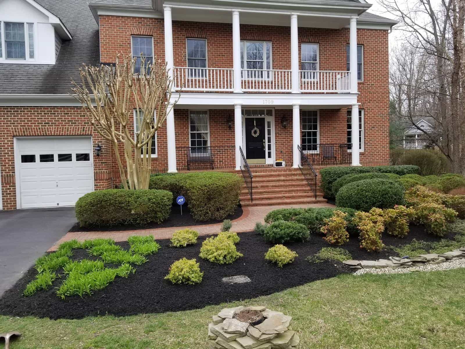 A large brick house with a white garage door
