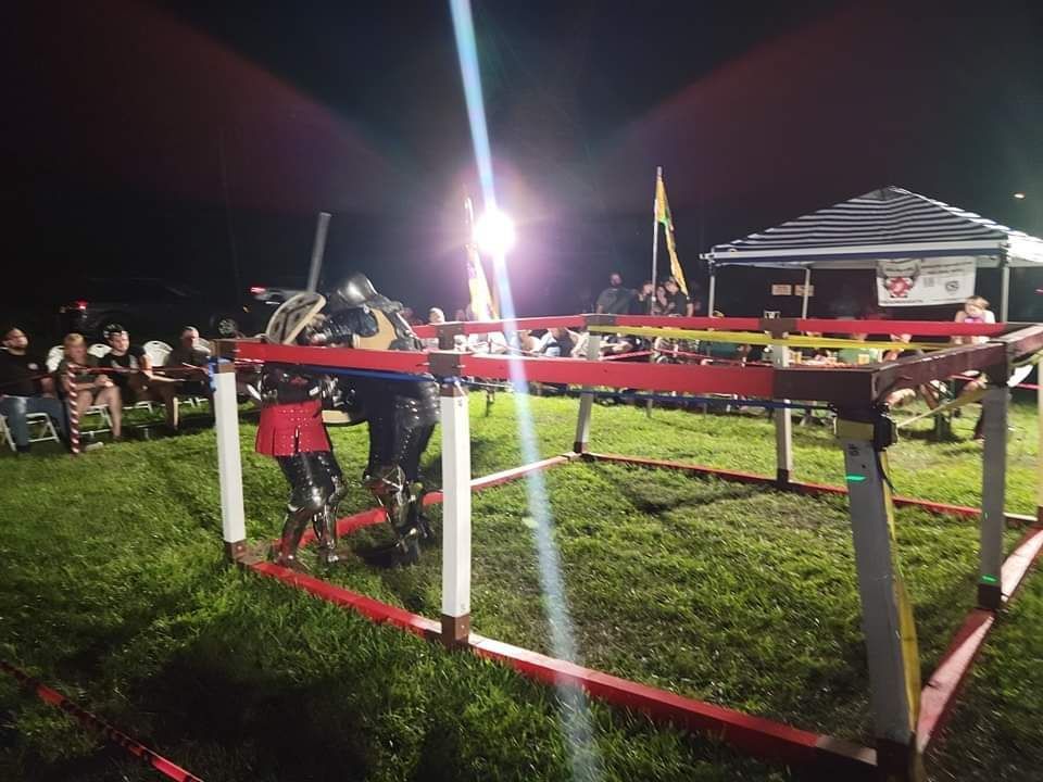 A Group of People Are Playing a Game in A Field - DE - Diamond State Steel Academy
