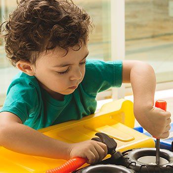 Child Education — Kid Playing Toy Tools in Norman, OK