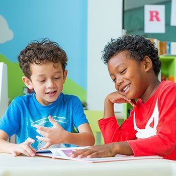 Children's Learning Center — Two Kid's Discussing in Norman, OK