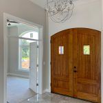 A Beautiful, Double-Door Wooden Entrance Created by Watts Construction in Mid-Missouri