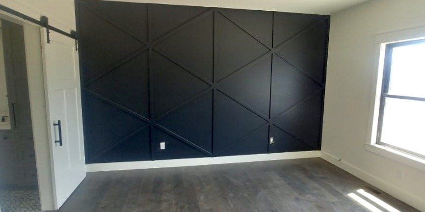 A Wide Room With a Black Wall Designed by Watts Construction Mid-MO Contractors