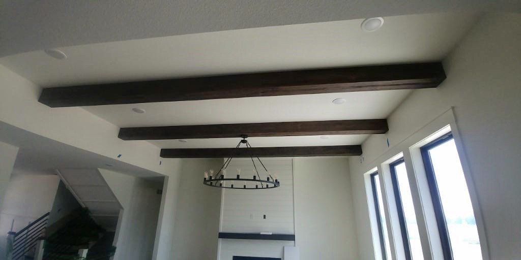 A Ceiling With a Chandelier by Watts Construction in Mid-MO