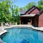 A Home With an Outdoor Pool in Mid-Missouri by Watts Construction
