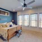 An Open Bedroom With Blue & White Walls, Created by Watts Construction in Mid-Missouri