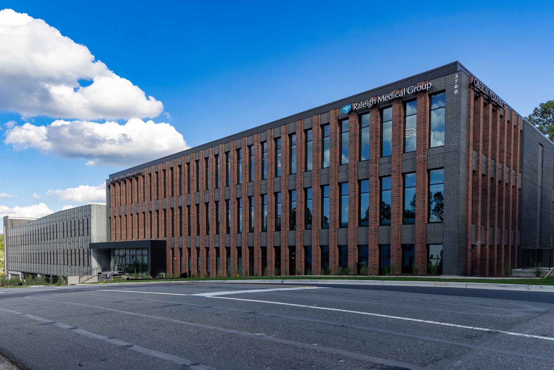 Modern brick building with blue sky.