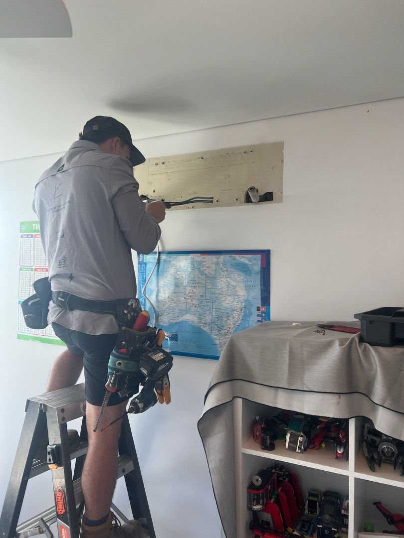 A Person Terminating The Cable For An Air Conditioner Installation — Kilowatts & Cool Whitsundays In Strathdickie, QLD