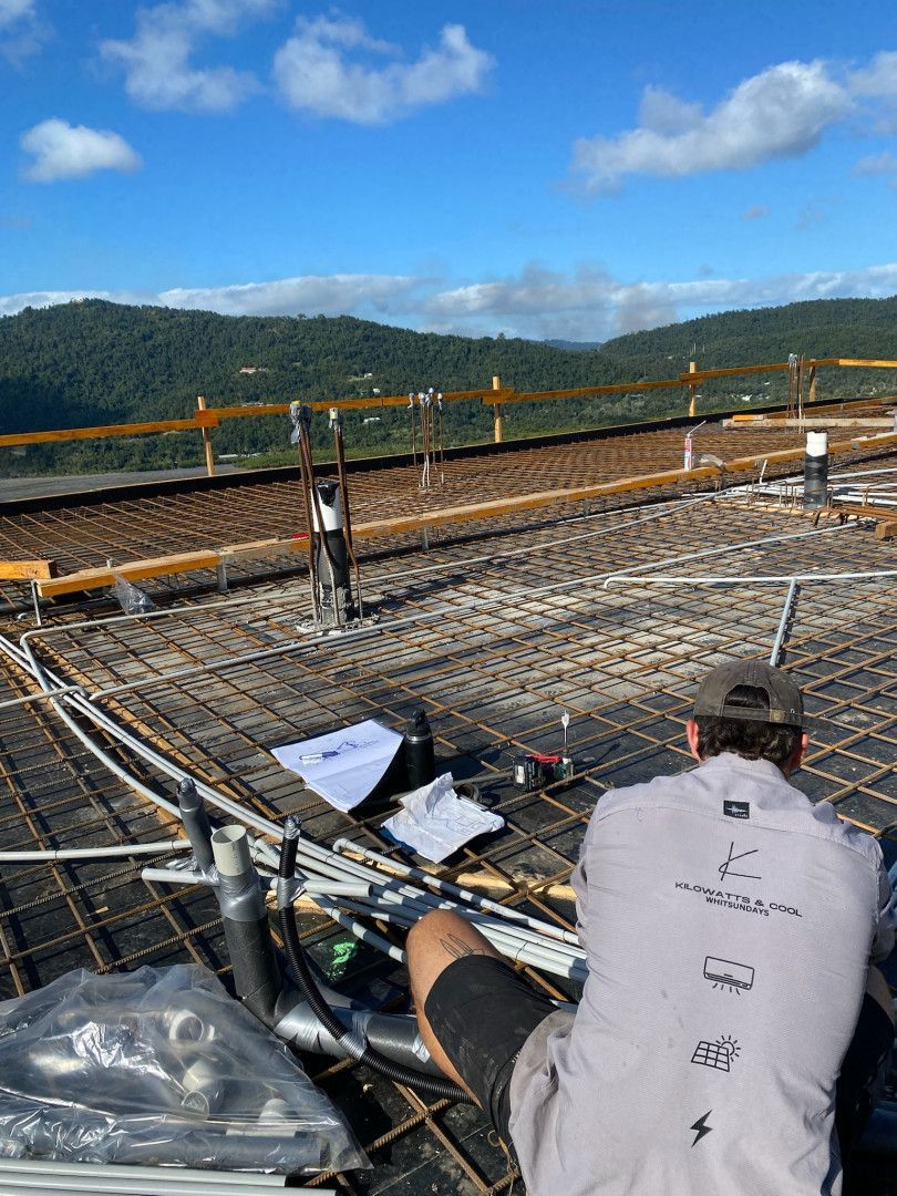 A Man Organising Cable On A New Residential Site — Kilowatts & Cool Whitsundays In Strathdickie, QLD