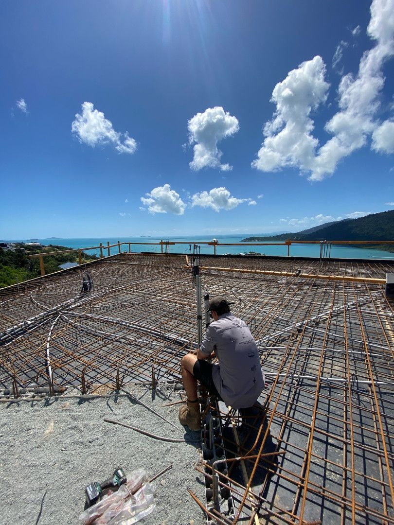 A Man Organising Cable On A New Residential Site — Kilowatts & Cool Whitsundays In Strathdickie, QLD