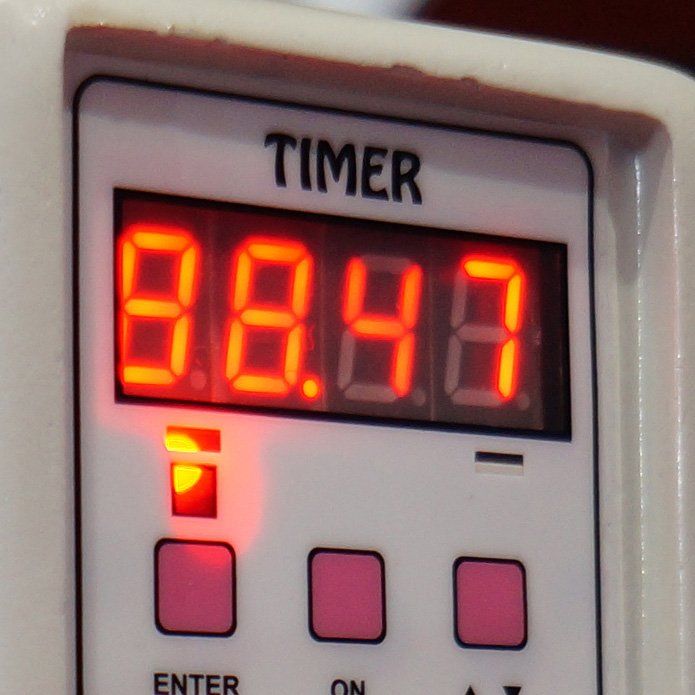 Close-up view of an Industrial timer on a control panel stock photo