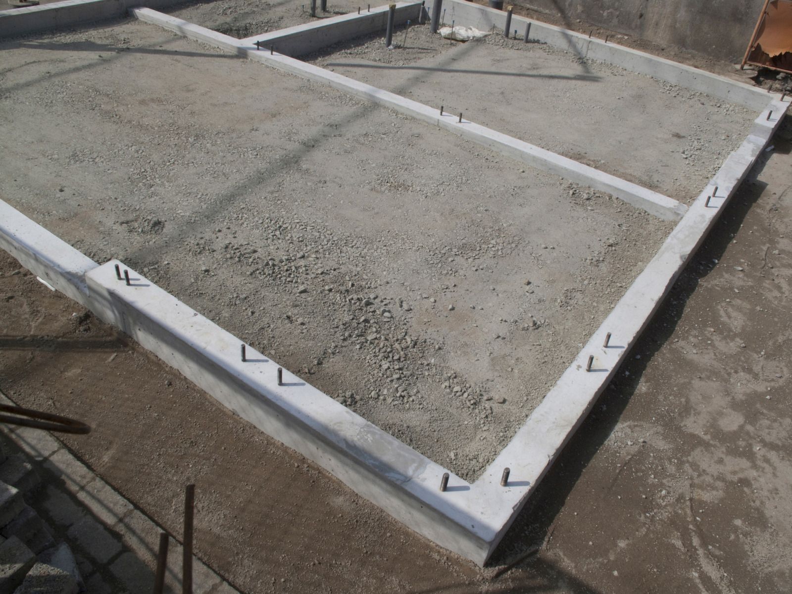 A concrete floor with a white border is being built.