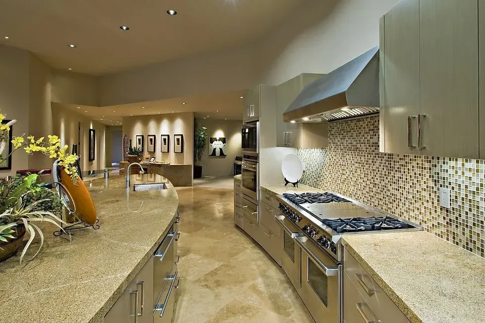 A kitchen with stainless steel appliances and granite counter tops