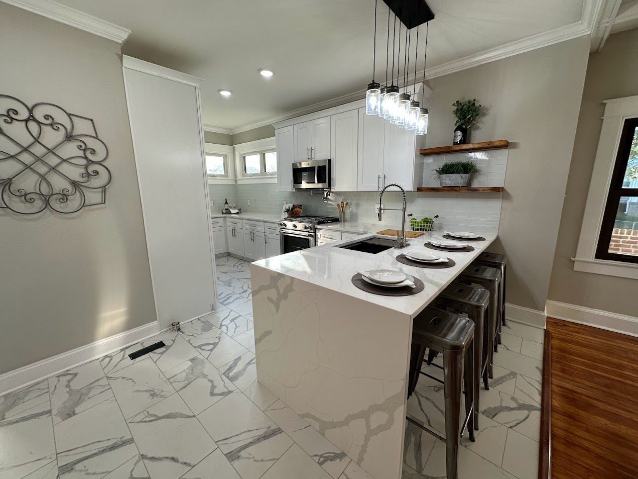 A kitchen with a large island in the middle of the room.