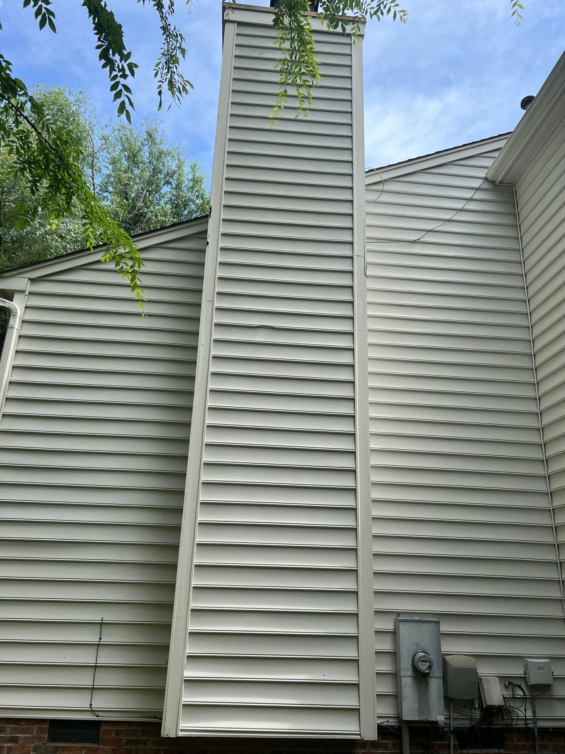 Close-up of freshly cleaned vinyl siding after pressure washing in Wake County, NC