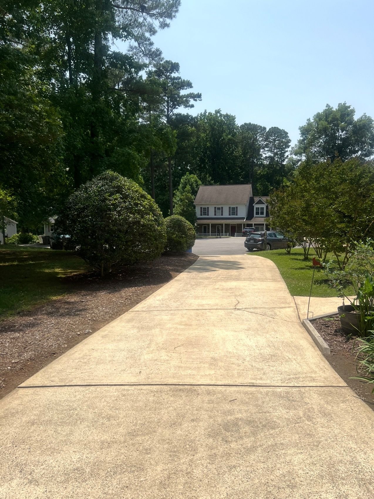 Freshly cleaned driveway after pressure washing in Wake County, NC