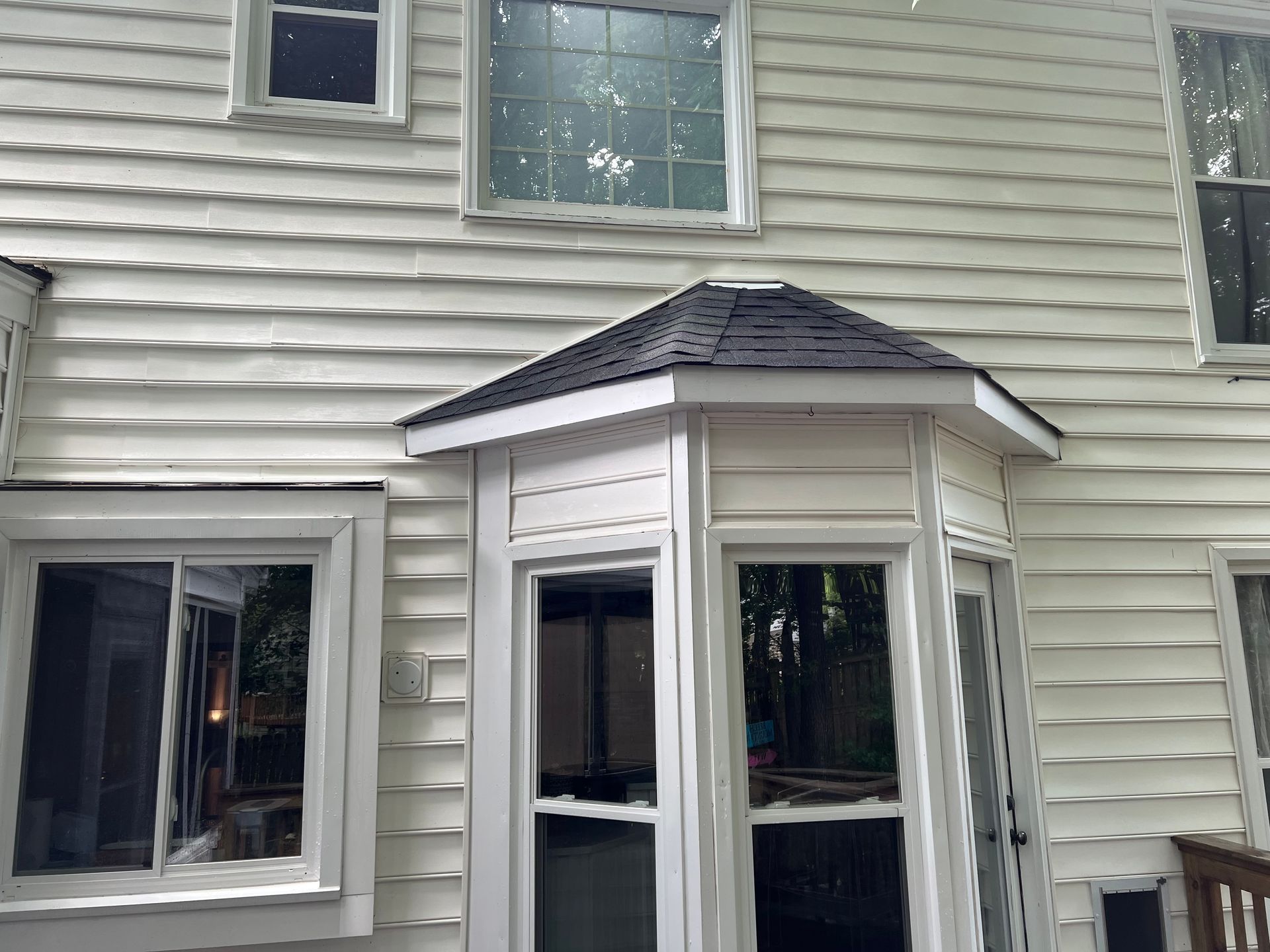 Bay window and siding restored after soft wash pressure washing in Apex, NC