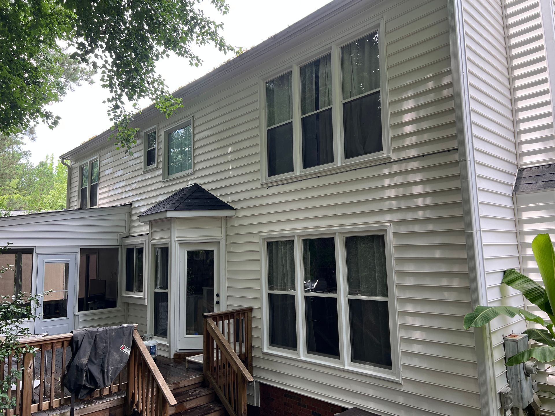 Cleaned back patio and siding after full house pressure washing in Wake County, NC
