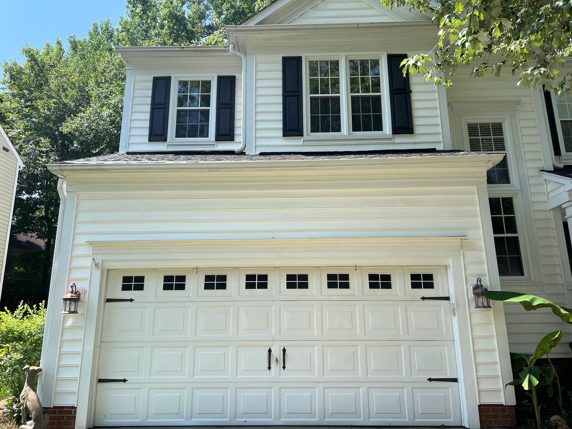 fter photo of pressure washed garage exterior in Cary, NC with restored white siding