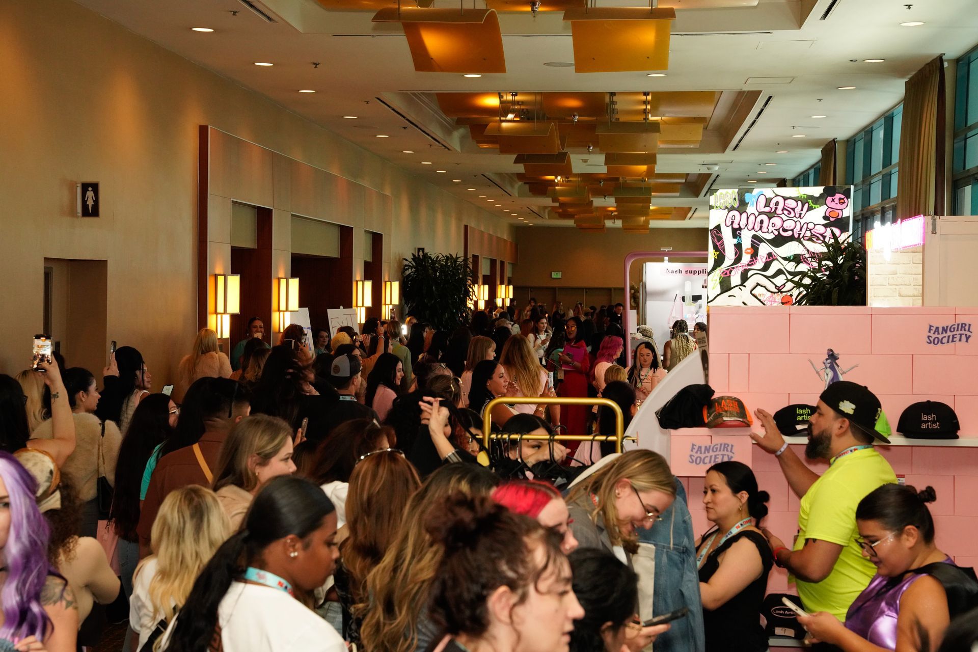 A large group of people are gathered in a large room.