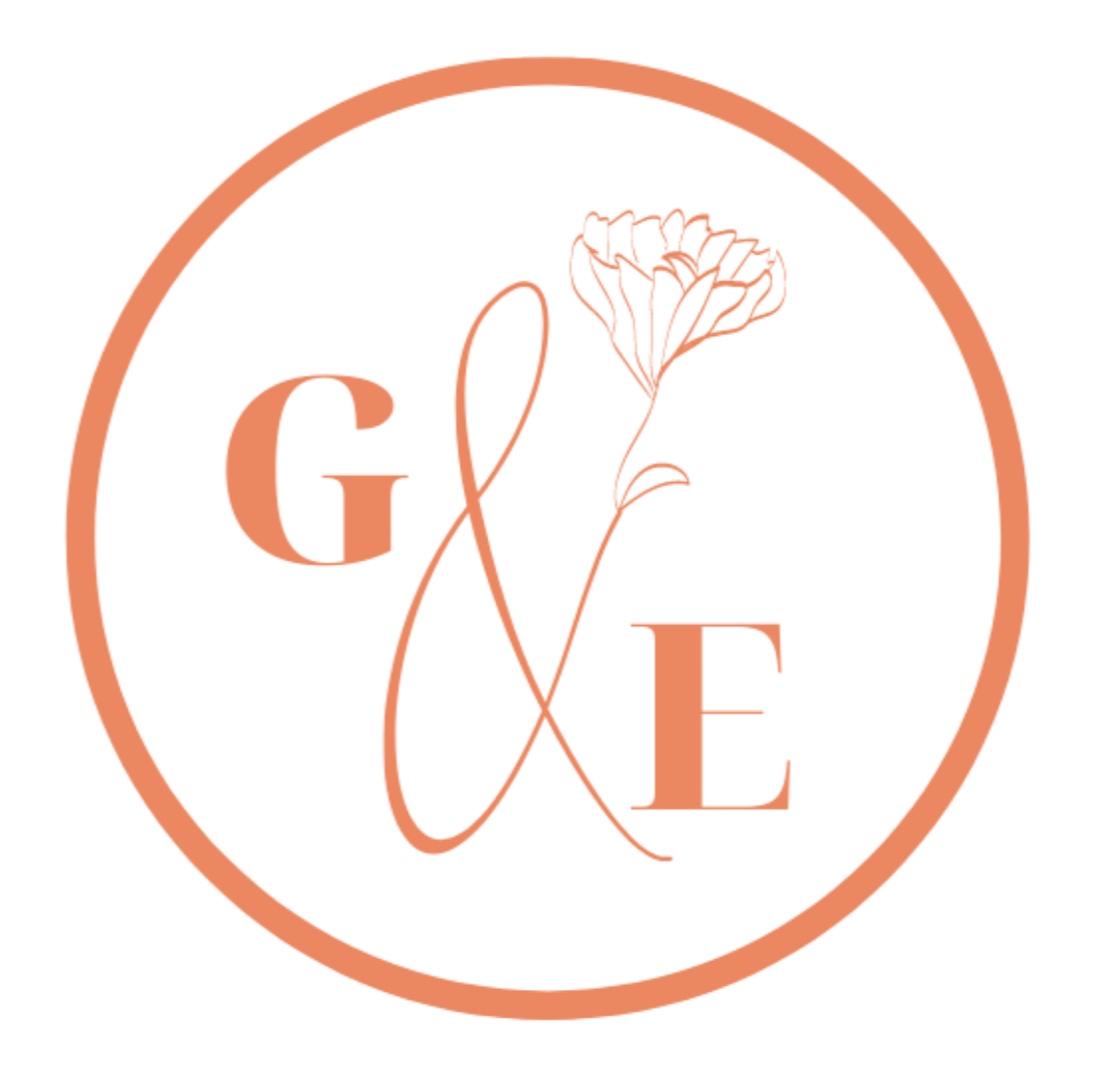 A circular logo with the letters 