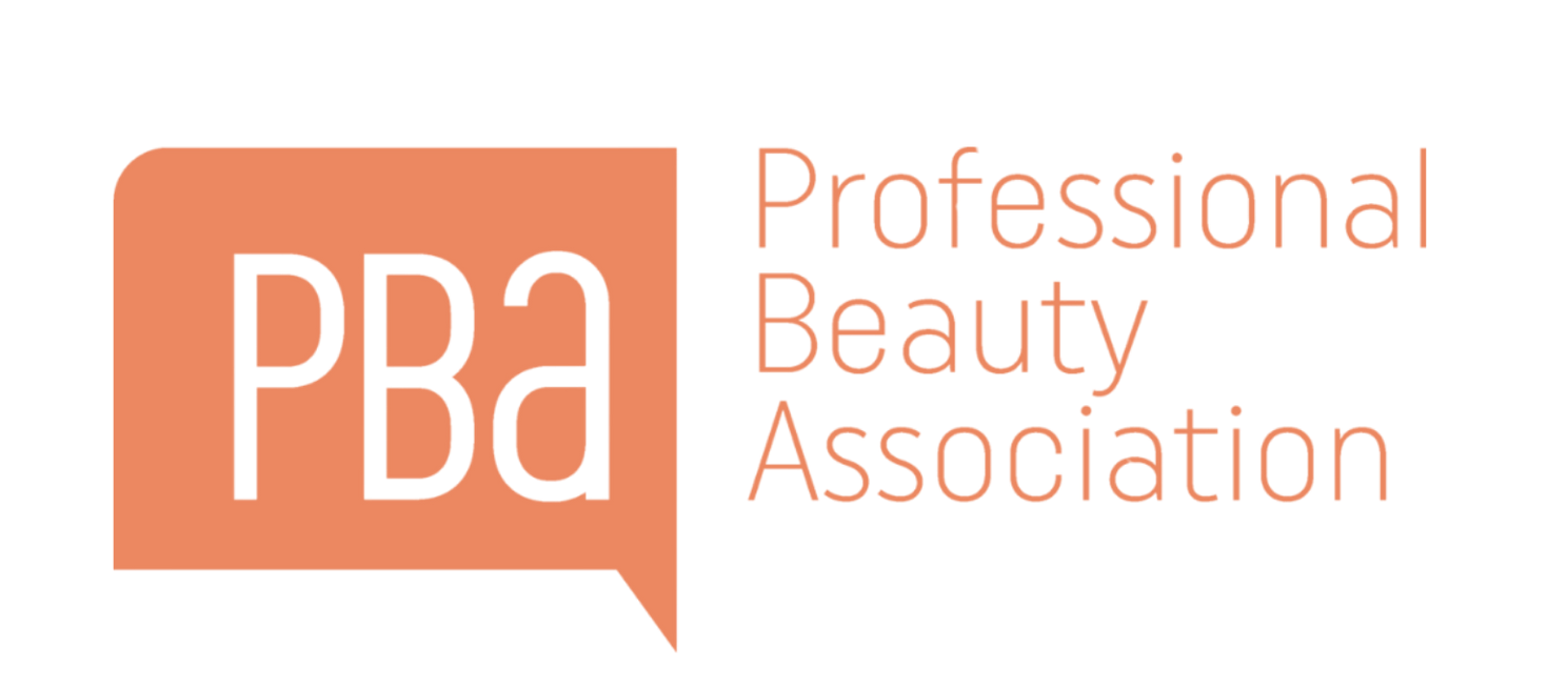 The Professional Beauty Association logo: white letters 