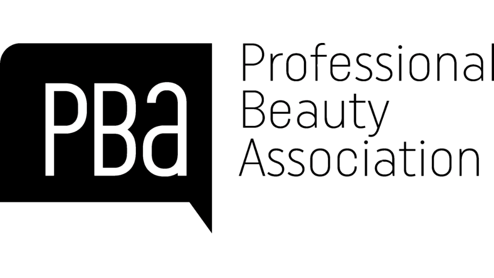 The logo for the professional beauty association is black and white.