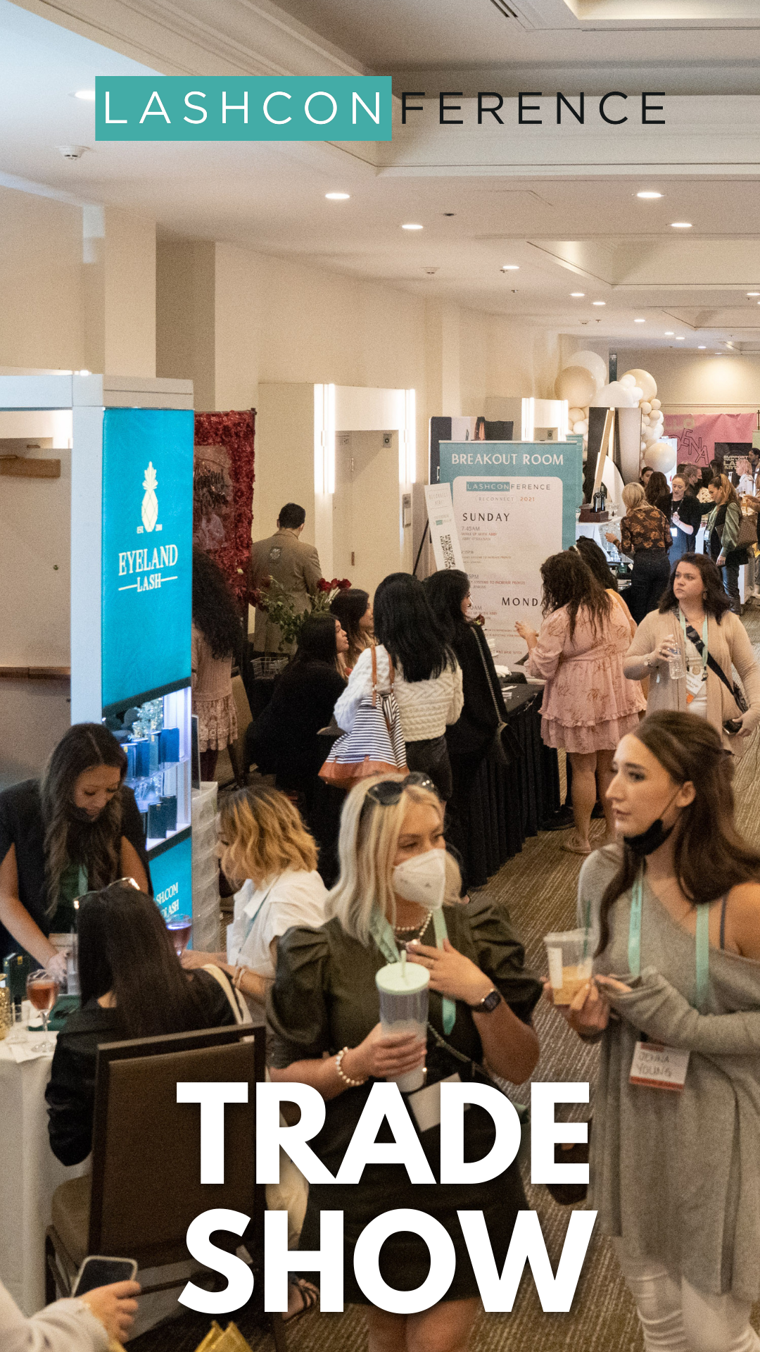 A group of people are standing in a room at a trade show.